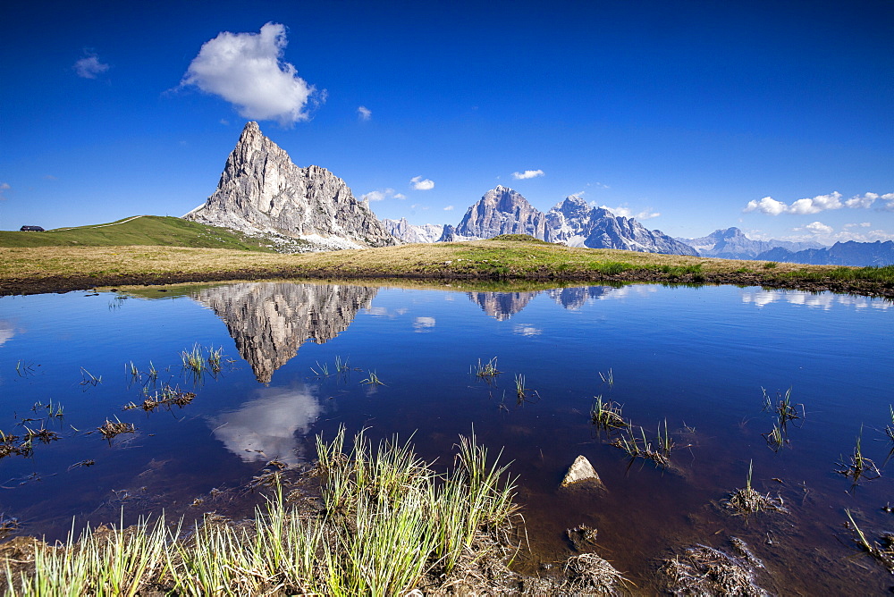 The Gusela peak and the Tofane Group by Cortina D'Ampezzo reflecting in the lake by Passo Giau, Veneto, Italy, Europe