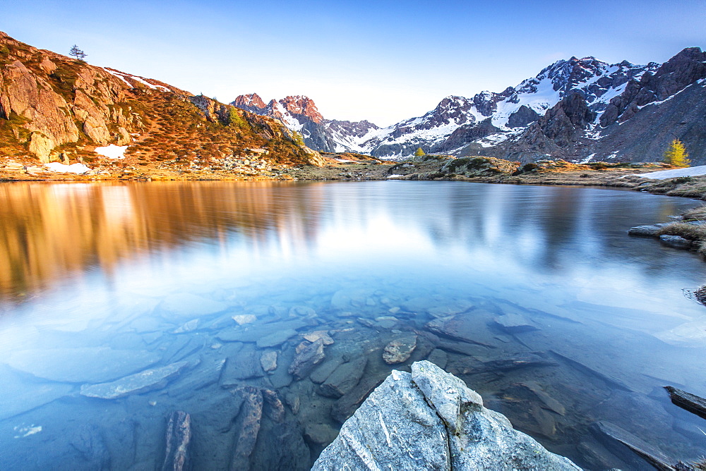 Snowy peaks reflected in Lake Zana at sunrise, Malenco Valley, Valtellina, Province of Sondrio, Lombardy, Italy, Europe