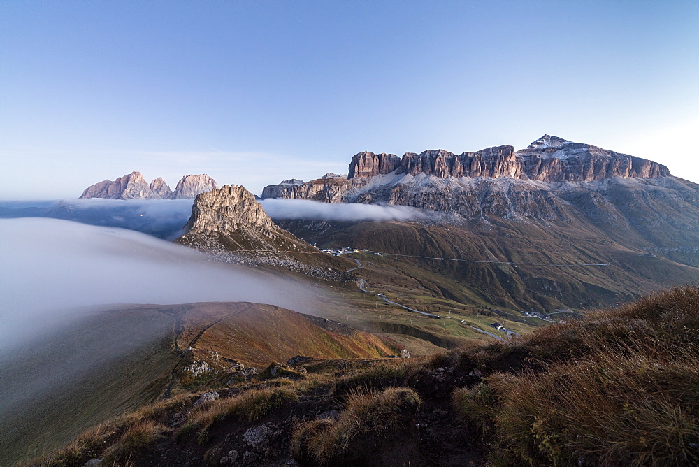 Piz Boa Sassolungo and Sass Beca shrouded in morning fog Cima Belvedere, Canazei, Val di Fassa, Trentino-Alto Adige, Italy, Europe