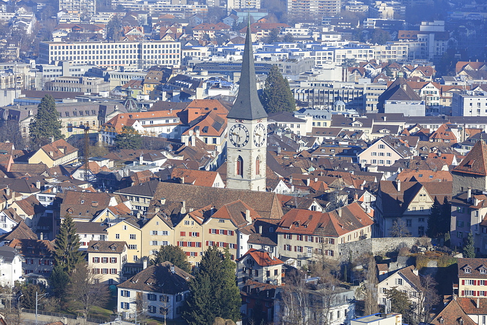 View of bell tower of Church of St. Martin and the city of Chur, district of Plessur, Canton of Graubunden, Swiss Alps, Switzerland, Europe