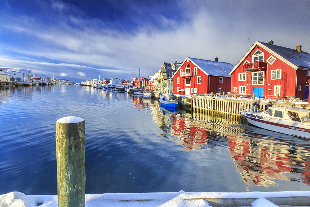 View of colorful fishermen's houses and private boats overlooking the canal-port of Henningsvaer, Lofoten Islands, Arctic, Norway, Scandinavia, Europe