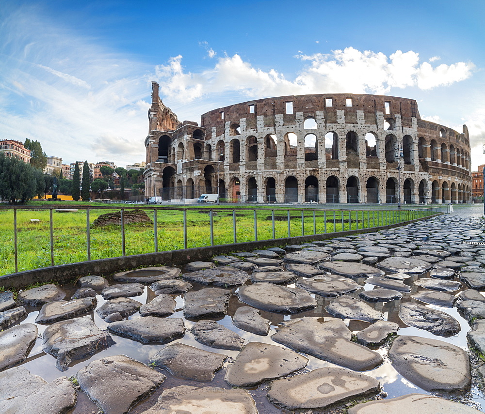 Blue sky at sunrise frames the ancient Colosseum (Flavian Amphitheatre), UNESCO World Heritage Site, Rome, Lazio, Italy, Europe