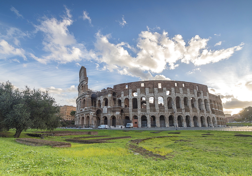 Blue sky at sunrise frames the ancient Colosseum (Flavian Amphitheatre), UNESCO World Heritage Site, Rome, Lazio, Italy, Europe