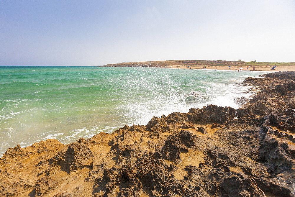 The waves of turquoise sea crashing on the rocks, Pozzallo, Province of Ragusa, Sicily, Italy, Mediterranean, Europe