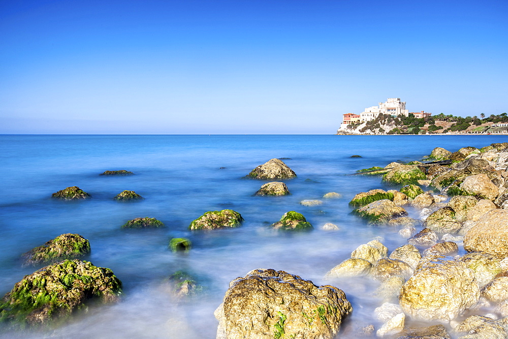 Sunrise on turquoise sea frames the medieval Falconara Castle, Butera, Province of Caltanissetta, Sicily, Italy, Mediterranean, Europe