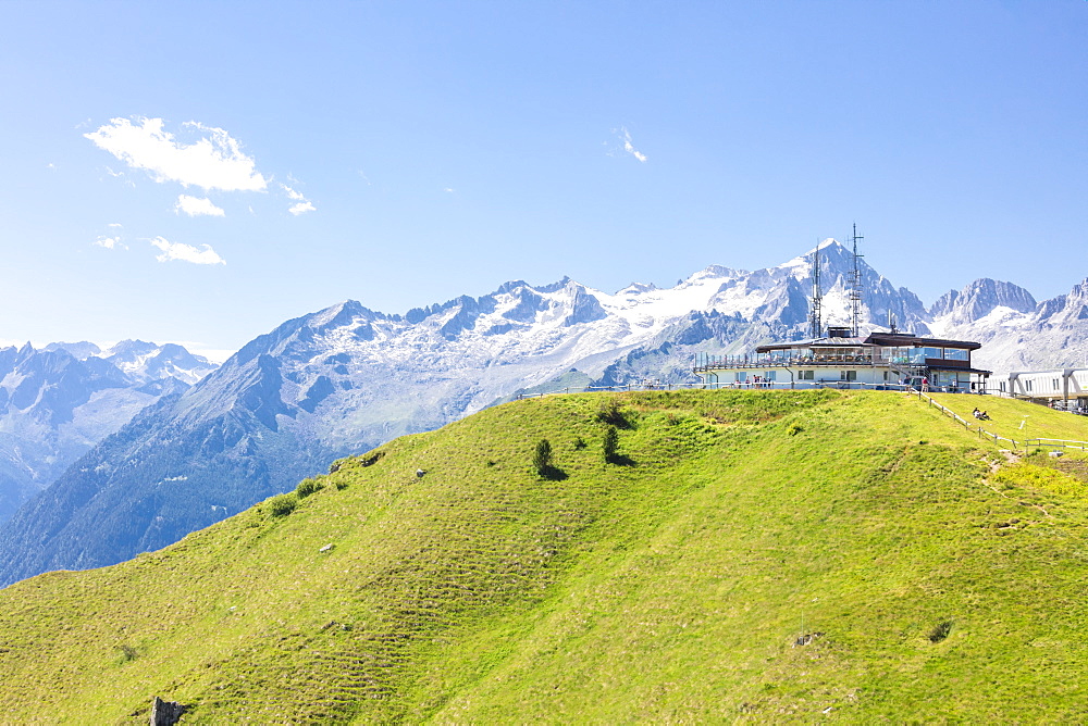 Green meadows and rocky peaks frame the Rifugio Doss Del Sabion, Pinzolo, Brenta Dolomites, Trentino-Alto Adige, Italy, Europe