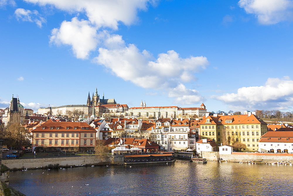 View of the Vltava River surrounded by the historical buildings, Prague, Czech Republic, Europe