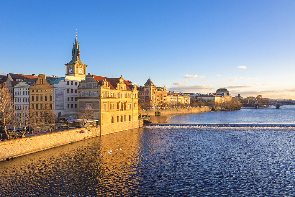 View of the Vltava River framed by historical buildings and bridges, Prague, Czech Republic, Europe