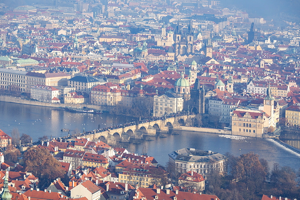 View of typical buildings and ancient churches framed by the River Vltava, Prague, Czech Republic, Europe