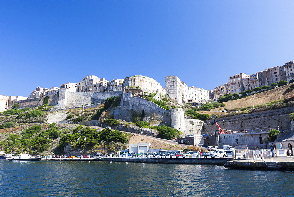 Blue sea frames the medieval old town and fortress, Bonifacio, Corsica, France, Mediterranean, Europe