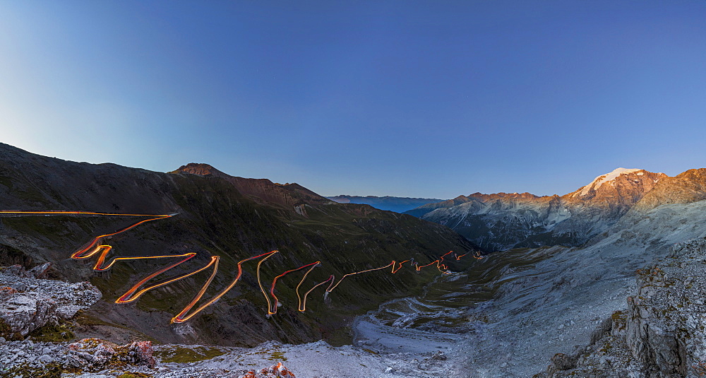 Panorama of lights of car trace at dusk, Stelvio Pass, Valtellina, Lombardy, Trentino Alto Adige, Italy, Europe