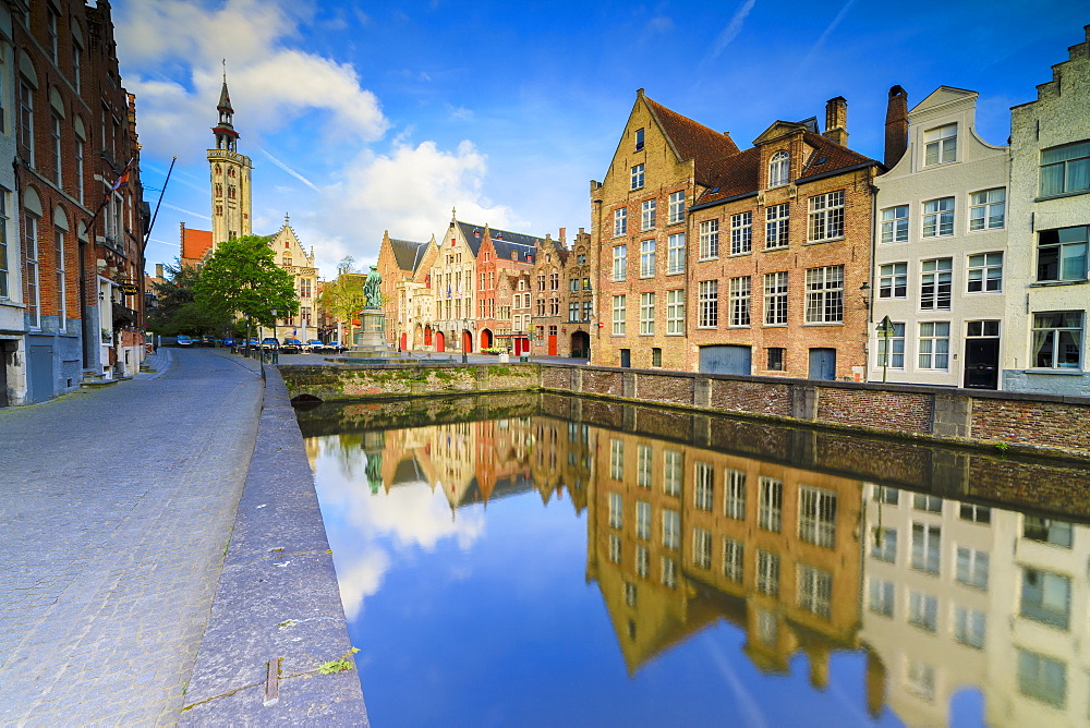 Bright sky at dawn on historic buildings and houses of city centre reflected in the canal, Bruges, West Flanders, Belgium, Europe