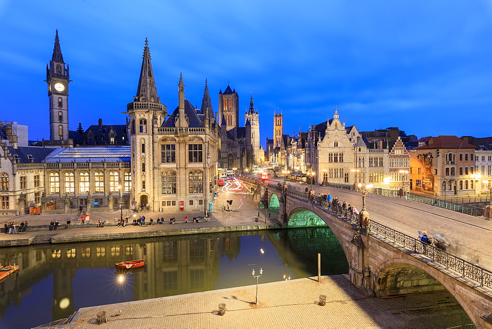 View of the historic area of Graslei and bell tower along Leie river at dusk, Ghent, Flemish Region, East Flanders, Belgium, Europe