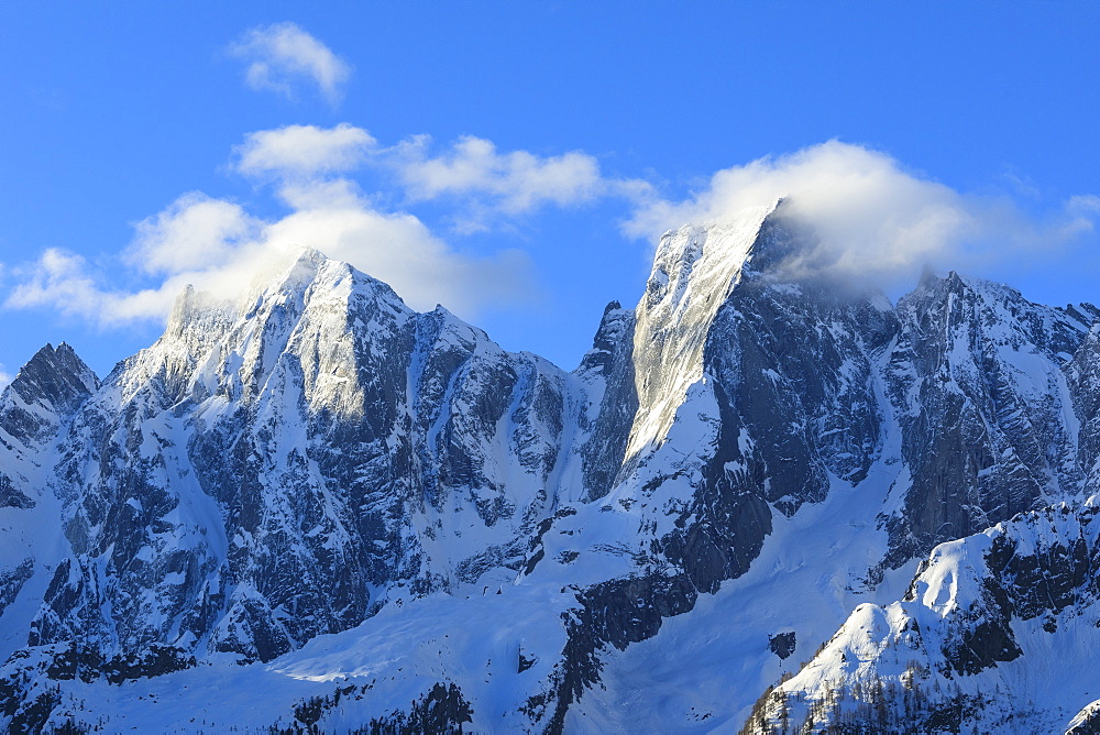 Rocky peaks Badile and Cengalo covered with snow in spring, Soglio, Bregaglia Valley, canton of Graubunden, Switzerland, Europe