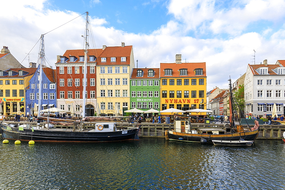 Colourful facades along canal and entertainment district of Nyhavn, Copenhagen, Denmark, Europe