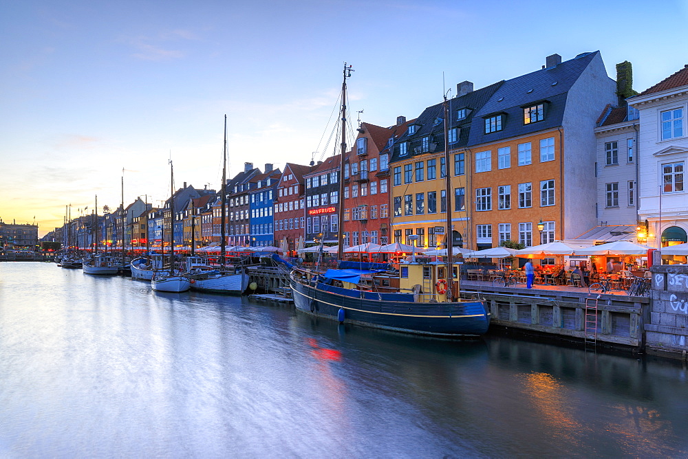 Blue lights of dusk on harbour and canal of the entertainment district of Nyhavn, Copenhagen, Denmark, Europe