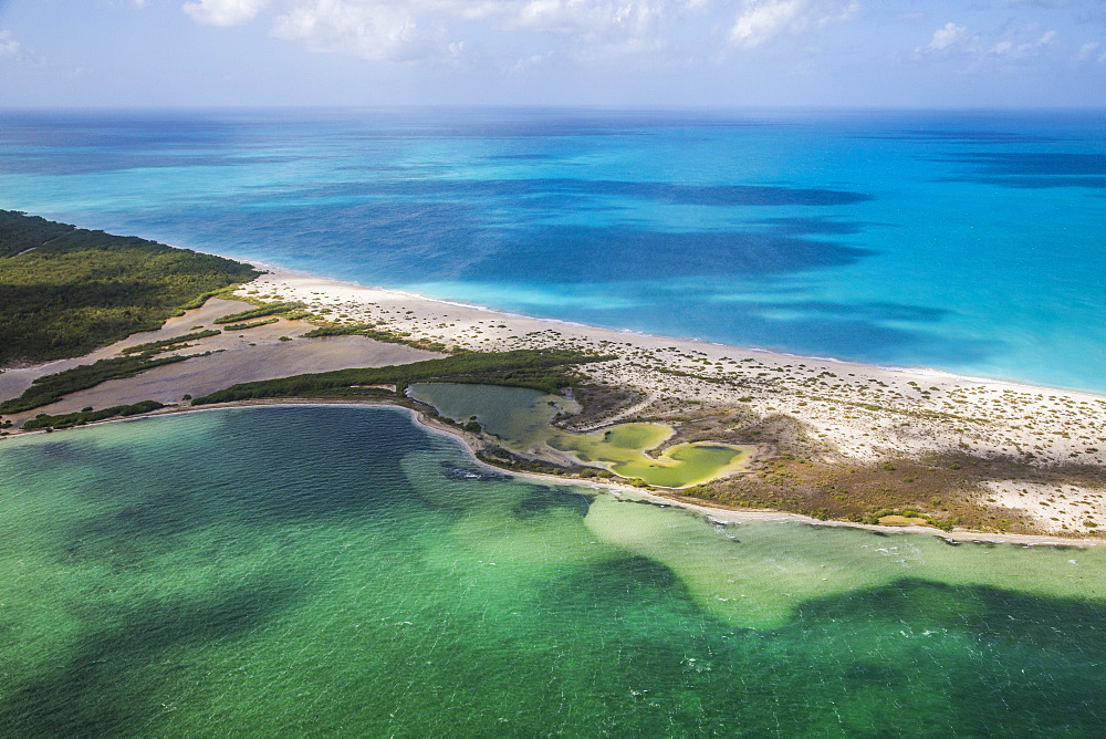 Aerial view of a corner of Barbuda, the Frigate Bird Sanctuary touches a thin strip of sand that separates the Caribbean Sea, Barbuda, Antigua and Barbuda, Leeward Islands, West Indies, Caribbean, Central America