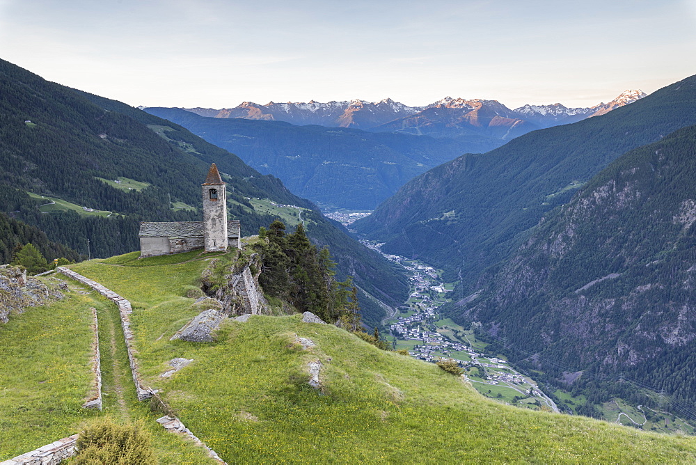 Ancient church at sunrise, San Romerio Alp, Brusio, Canton of Graubunden, Poschiavo Valley, Switzerland, Europe