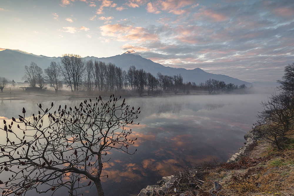 Clouds reflected in River Mera at dawn, Sorico, Como province, Lower Valtellina, Lombardy, Italy, Europe