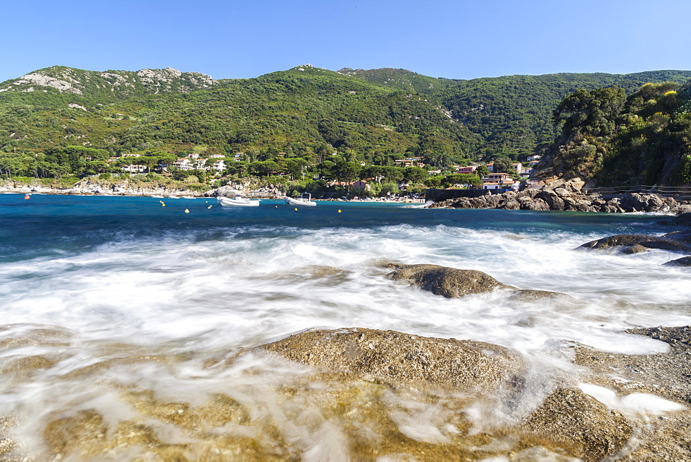 Waves crashing on rocks, Pomonte Beach, Marciana, Elba Island, Livorno Province, Tuscany, Italy, Europe