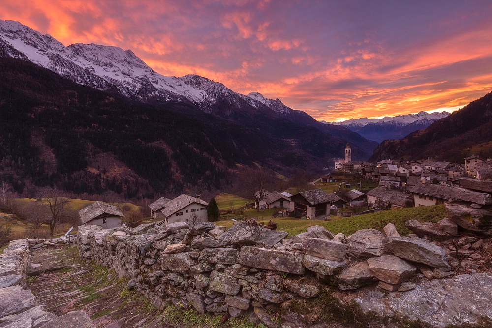 Fiery sky at sunset, Soglio, Bregaglia Valley, Maloja Region, Canton of Graubunden (Grisons), Switzerland, Europe