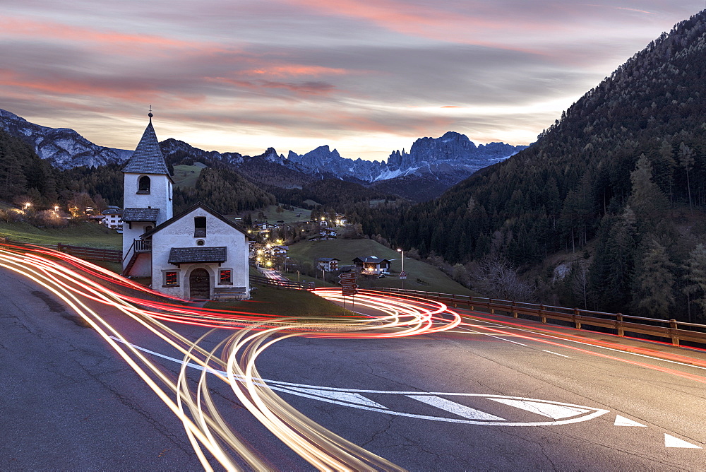 Lights of car trails around the Church of San Cipriano, Tires Valley, Dolomites, South Tyrol, Bolzano province, Italy, Europe