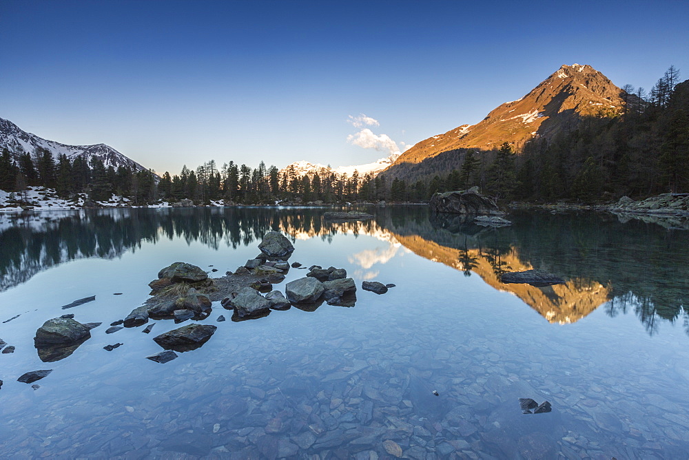 Corn Da Murasciola reflected in Lago di Saoseo, Val di Campo, Poschiavo region, Canton of Graubunden, Switzerland, Europe