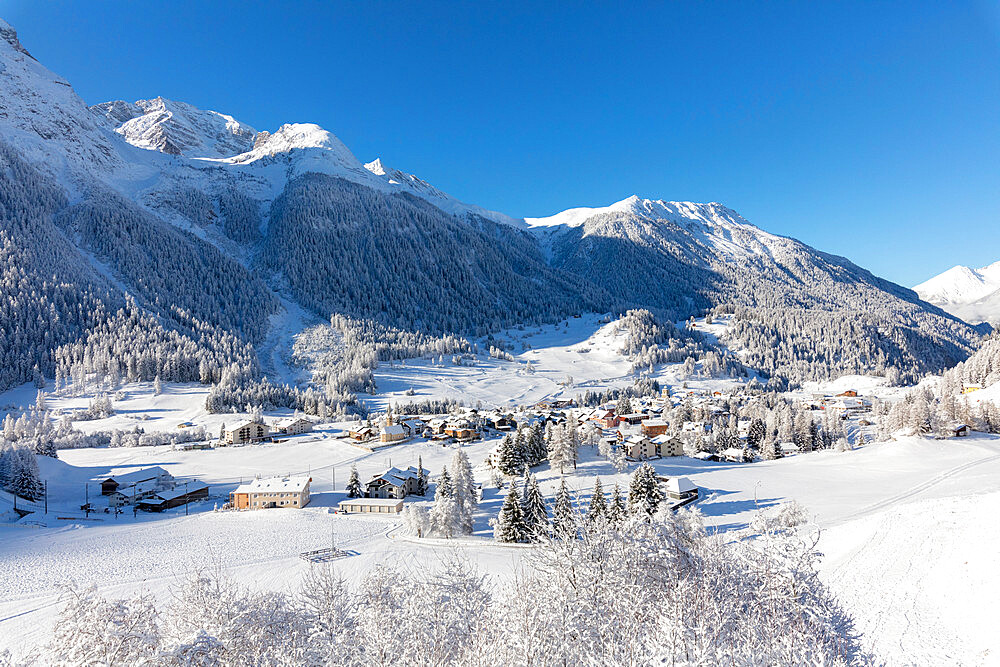 Alpine village of Bergun covered with snow, Albula Valley, Canton of Graubunden, Switzerland, Europe