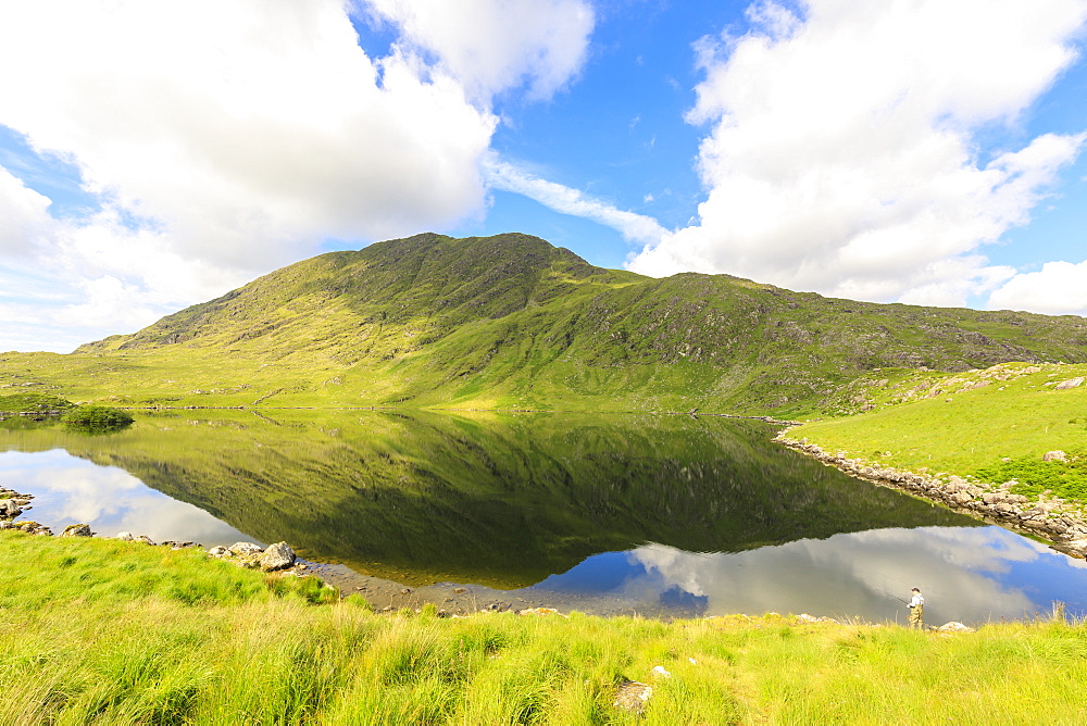 Mountains reflected in water, Killarney National Park, County Kerry, Munster, Republic of Ireland, Europe