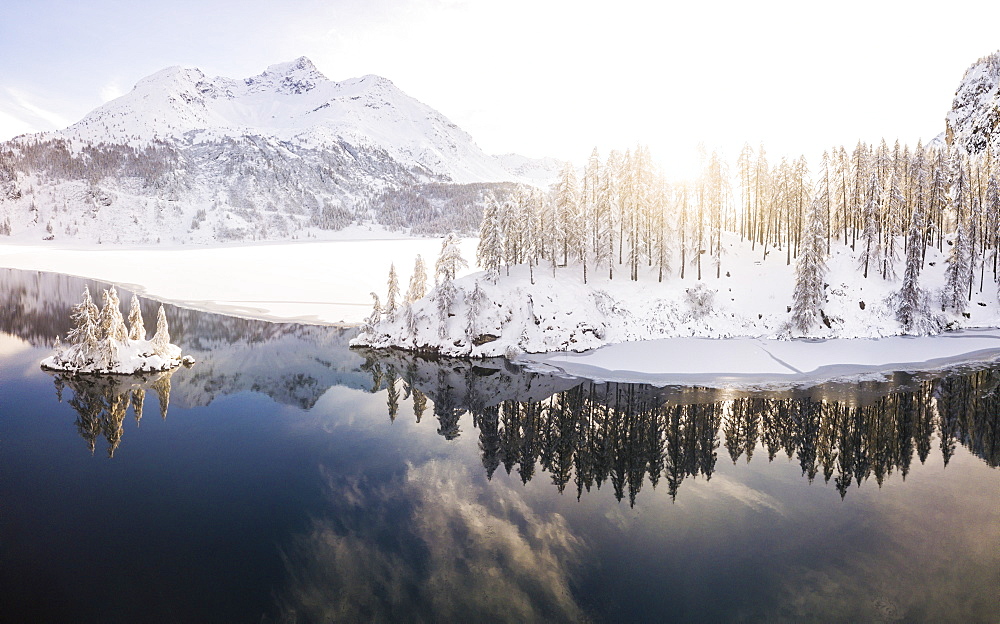 Aerial panoramic view of Lake Sils and Plaun da Lej during winter, Maloja Region, Canton of Graubunden, Engadine, Switzerland, Europe (Drone)