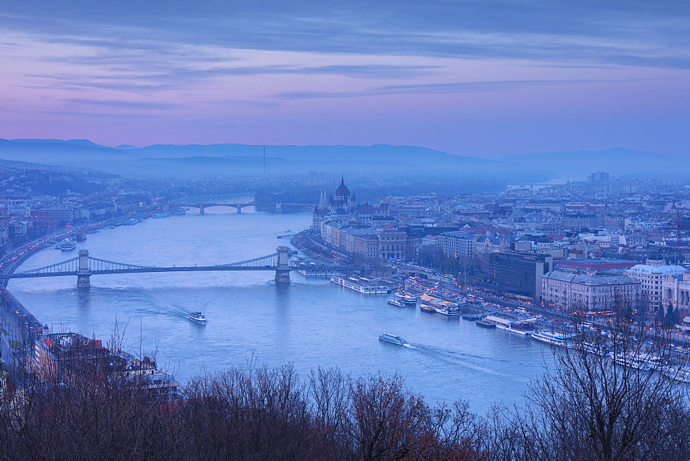 View over the city and River Danube at dusk from The Citadel on Gellert Hill, Budapest, Hungary, Europe