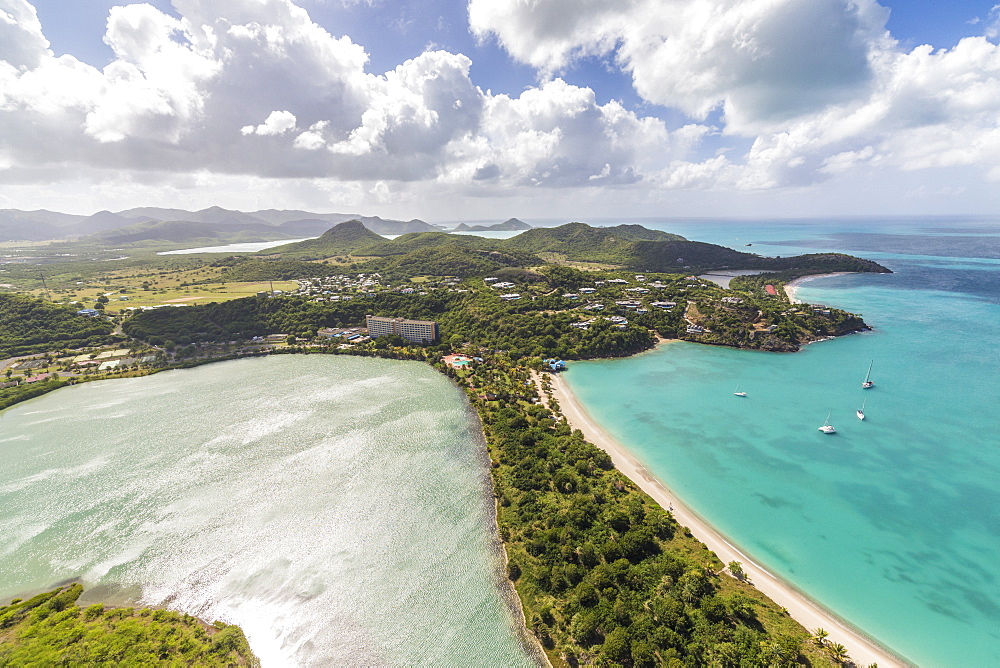 Aerial view of a lagoon on the Caribbean island of Antigua a thin line of sand divides the small salt basin from the sea, Antigua, Leeward Islands, West Indies, Caribbean, Central America