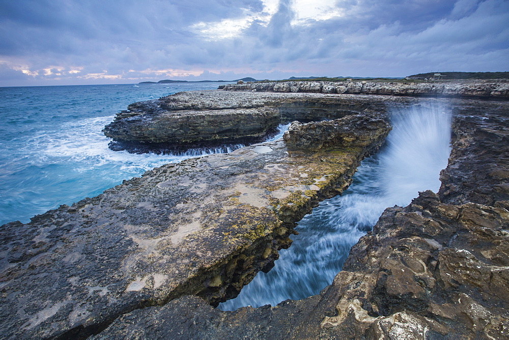 Geological Devil's Bridge, a natural arch carved by the sea from soft and hard limestone ledges of the Antigua formation, Antigua, Leeward Islands, West Indies, Caribbean, Central America