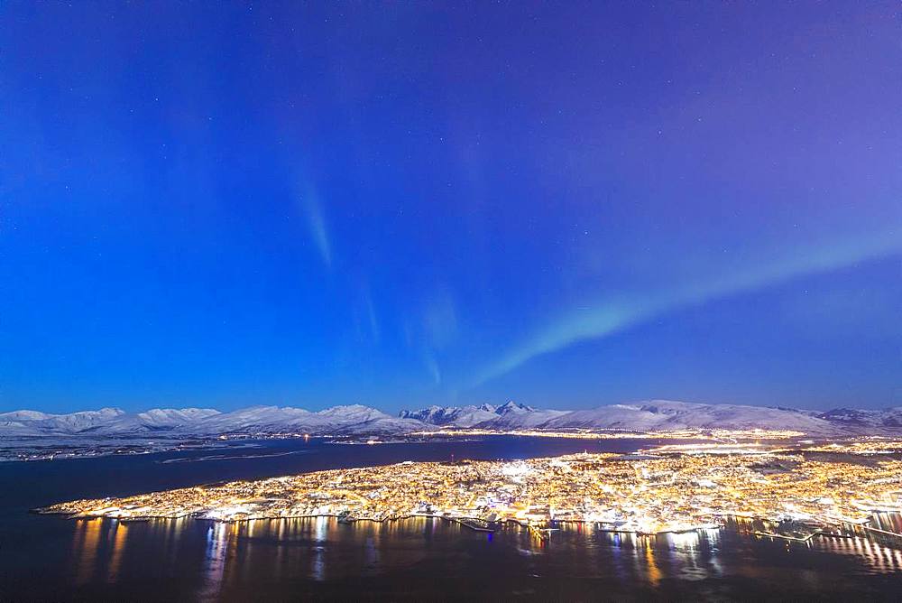 Northern Lights (Aurora borealis) on the city of Troms seen from Fjellheisen, Troms county, Norway, Scandinavia, Europe