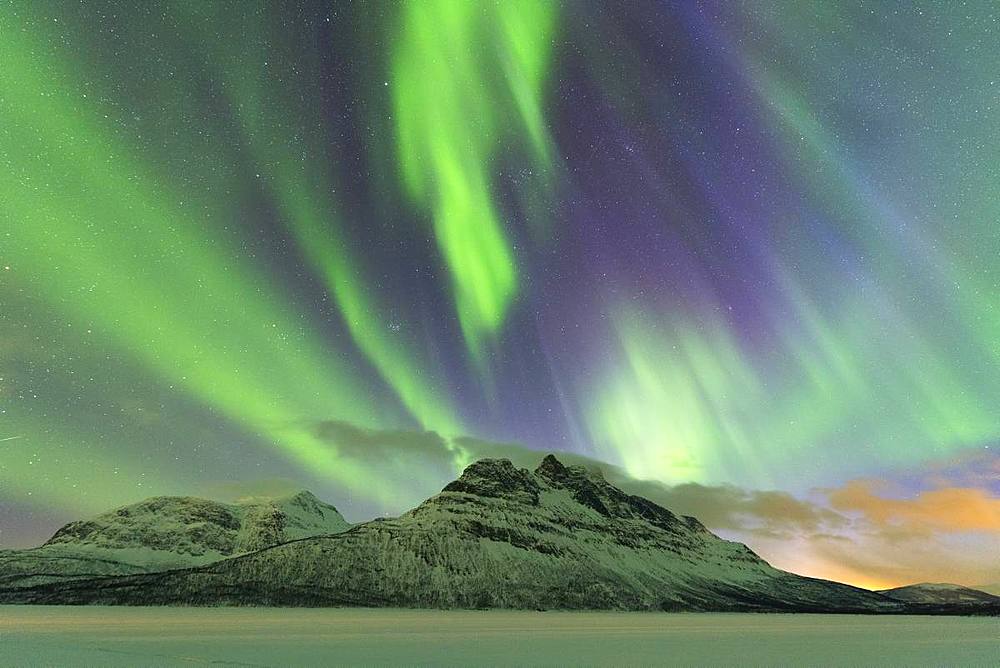 Northern Lights (Aurora borealis) on frozen lake Skoddebergvatnet, Grovfjord, Troms county, Lofoten Islands, Nordland, Norway, Europe