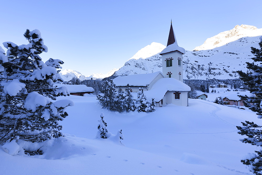 Chiesa Bianca surrounded by snow, Maloja, Bregaglia Valley, Engadine, Canton of Graubunden, Switzerland, Europe