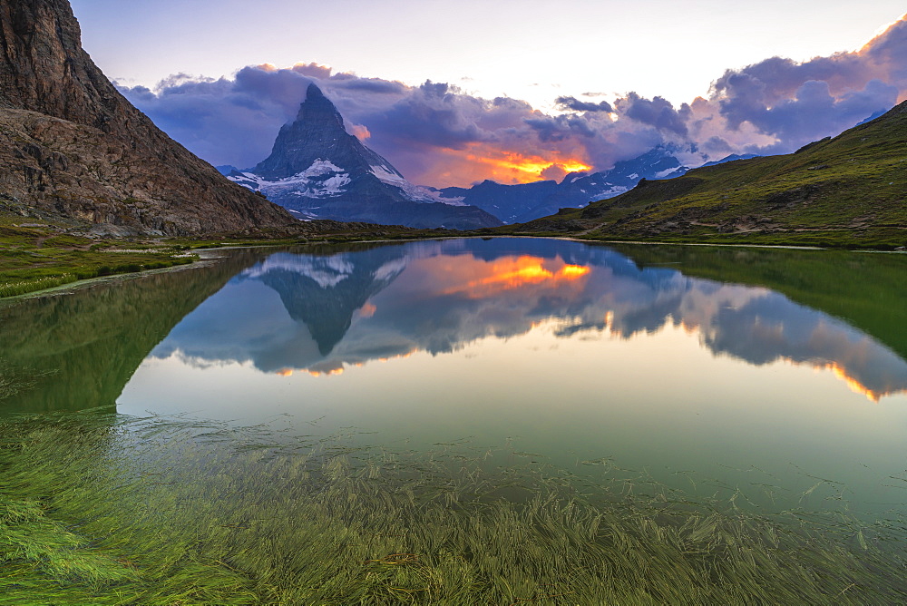 Sunset over the Matterhorn reflected in lake Riffelsee, Zermatt, canton of Valais, Swiss Alps, Switzerland, Europe