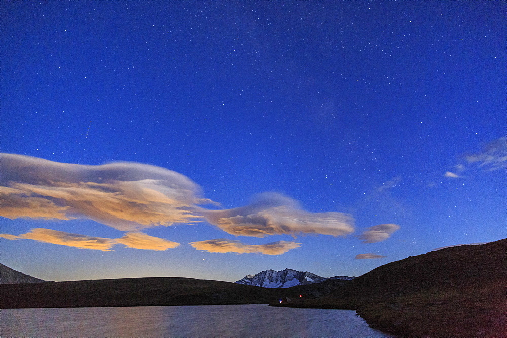 Pink clouds after sunset on Rossett Lake at an altitude of 2709 meters, Gran Paradiso National Park, Alpi Graie (Graian Alps), Italy, Europe 