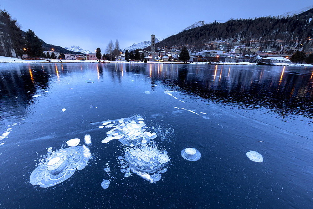 Ice bubbles trapped in the frozen Lake St. Moritz, Engadine, Canton of Graubunden, Switzerland, Europe