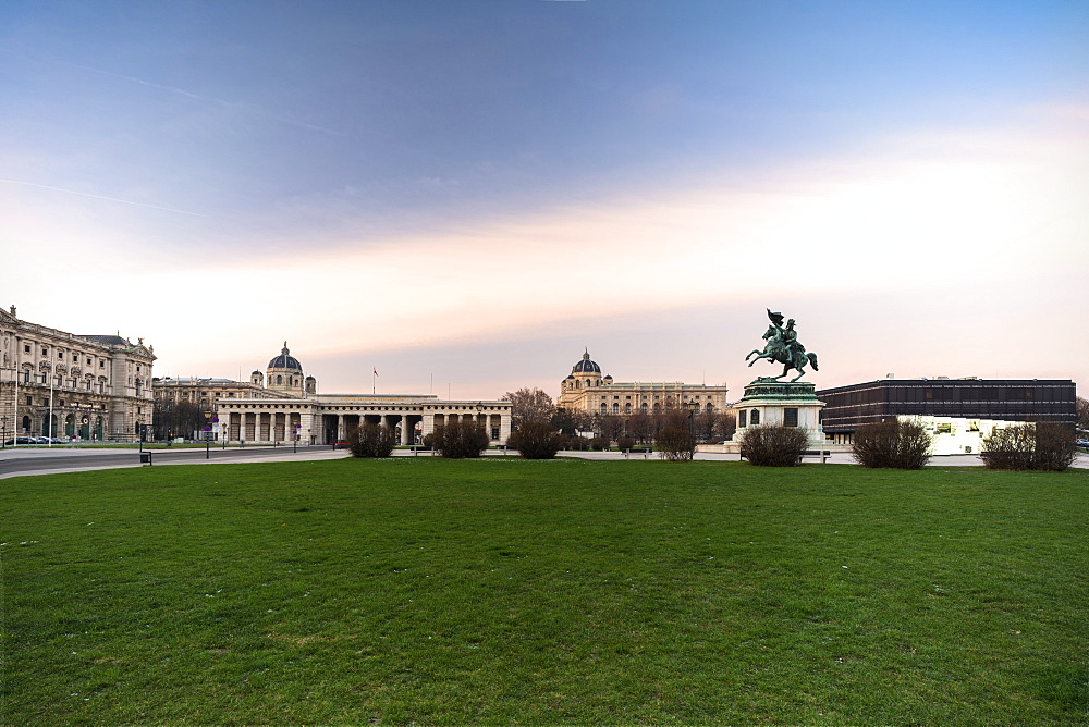 Sunrise over historic buildings and gardens of Heldenplatz (Heroes' Square), Vienna, Austria, Europe