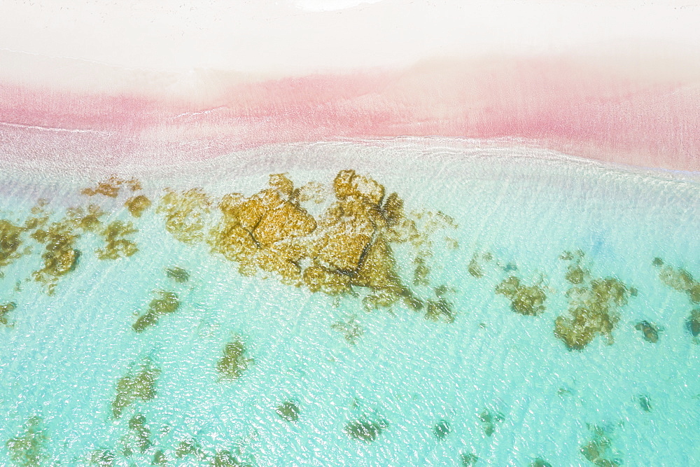 Waves of turquoise sea crashing into pink sand beach from drone above, Caribbean, Antilles, West Indies, Caribbean, Central America