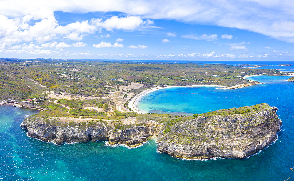 Aerial panoramic by drone of cliffs surrounding Half Moon Bay washed by Caribbean Sea, Antigua, Leeward Islands, West Indies, Caribbean, Central America