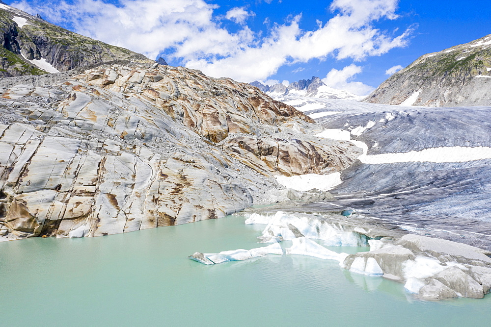 Rhone Glacier and glacial lake at its base in summer, aerial view, Gletsch, Canton of Valais, Switzerland, Europe