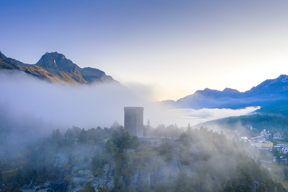 Aerial view by drone of mist over Torre Belvedere in autumn, Maloja Pass, Engadine, Canton of Graubunden, Switzerland, Europe