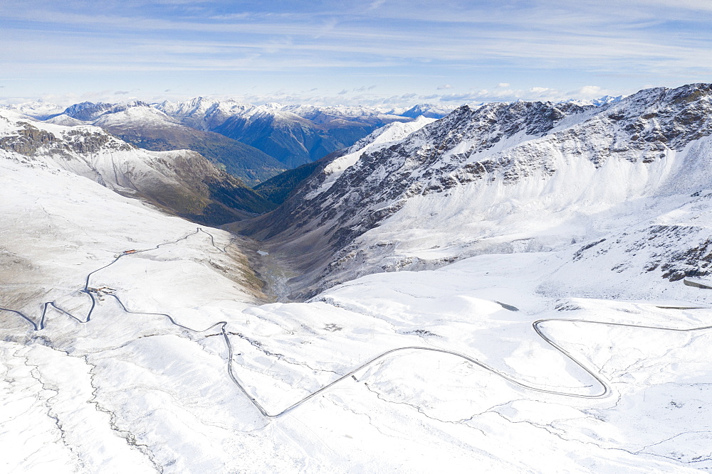 View by drone of mountain road in the snow, Giogo di Santa Maria (Umbrail Pass), Stelvio Pass, Sondrio province, Valtellina, Lombardy, Italy, Europe