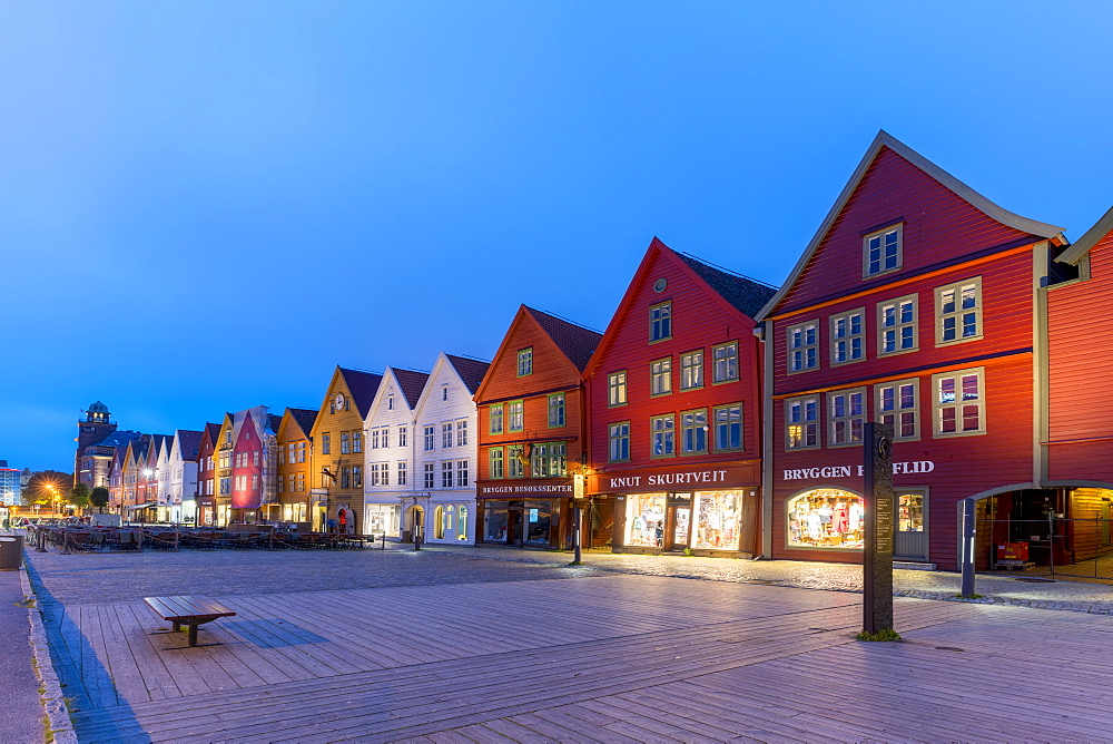 Illuminated timber buildings at dusk, Bryggen, UNESCO World Heritage Site, Bergen, Hordaland County, Norway, Scandinavia, Europe