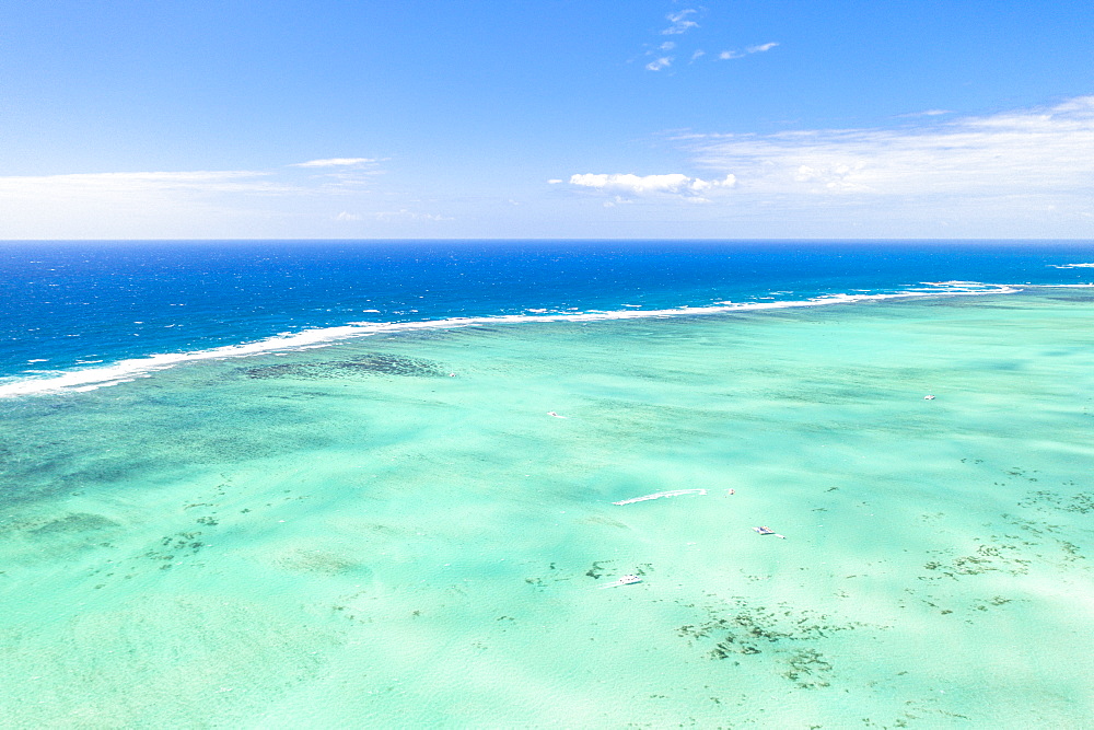 Turquoise coral reef meeting the blue Indian Ocean, aerial view by drone, Ile Aux Cerfs, Flacq district, Mauritius, Indian Ocean, Africa