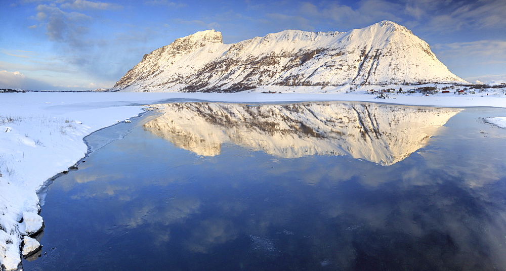 Snow capped mountains reflected in Steiropollen lake at sunrise, Lofoten Islands, Northern Norway, Arctic, Norway, Scandinavia, Europe