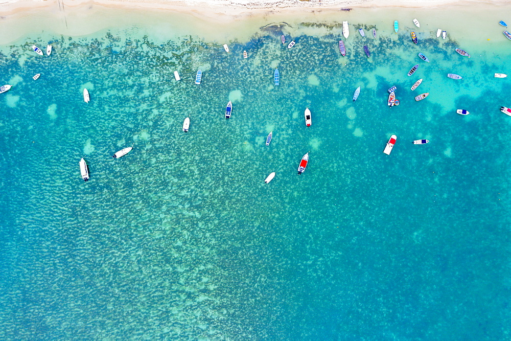 Aerial by drone of boats in the turquoise water of lagoon front of Mont Choisy beach, north-west coast, Mauritius, Indian Ocean, Africa