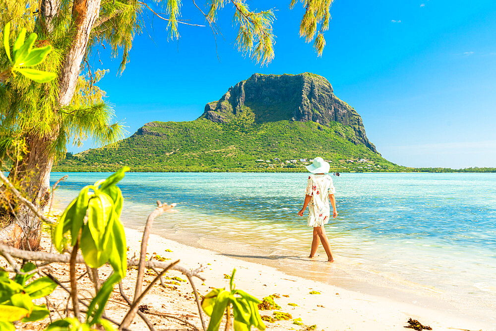 Woman walking on tropical sand beach, Ile aux Benitiers, La Gaulette, Le Morne, Black River, Mauritius, Indian Ocean, Africa